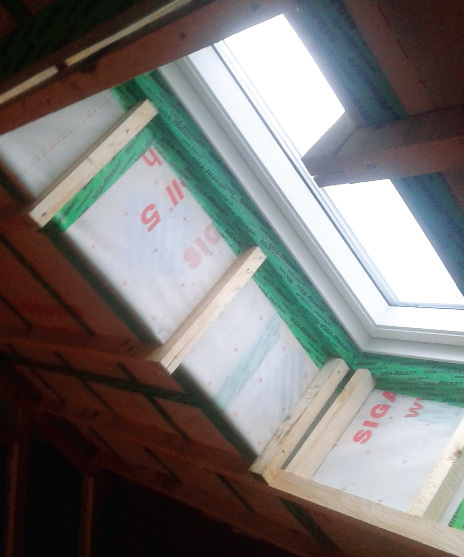 Airtightness detailing with Siga tapes and membranes around the Velux roof window