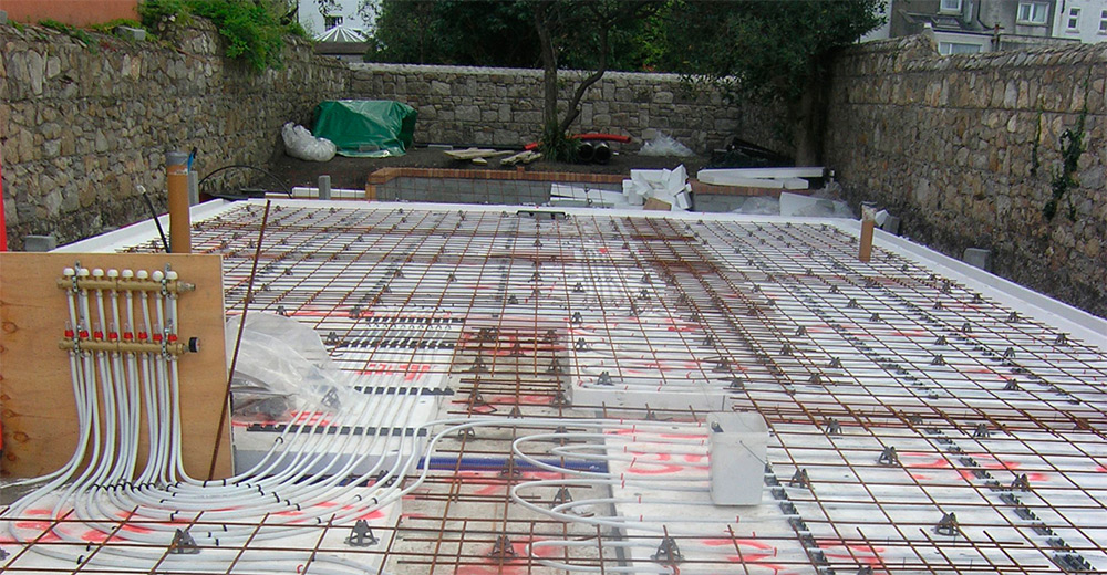 Installation almost complete of the reinforced steel mesh for the concrete slab, with underfloor heating also installed