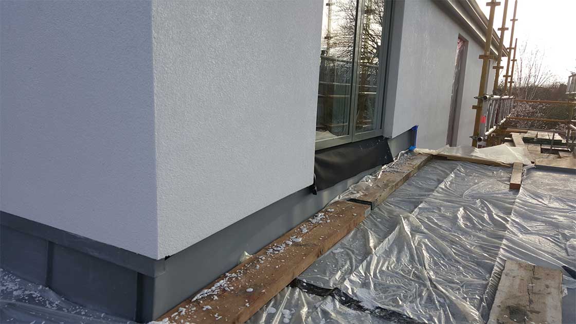 Compacfoam sole plate under EPDM membrane supporting window cill in external insulation layer, to prevent thermal bridging