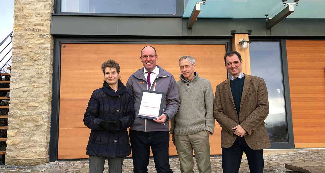 Handing over the certificate for reaching the new passive house plus standard, pictured are (l-r) Ruth Barnett, Ecowin MD Thomas Froehlich, Peter Richardson, and Adam Clark of Halliday Clark Architects.