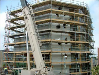 scaffolding on the timber structure lends perspective to the sheer scale of Ireland’s tallest timber frame building 