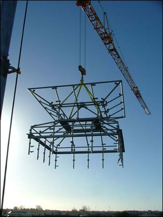 the stainless steel structure of the Venturi roof ventilator being lifted onto the building 