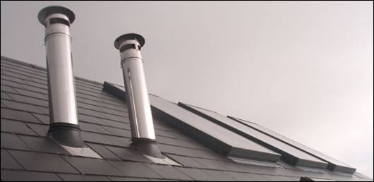 The insulated flue, supplied by Schiedel Chimney Systems, is brought through the house and terminates at a high level over the roof, ensuring that the flue will work well and that the residents should not experience bad odours outside the house