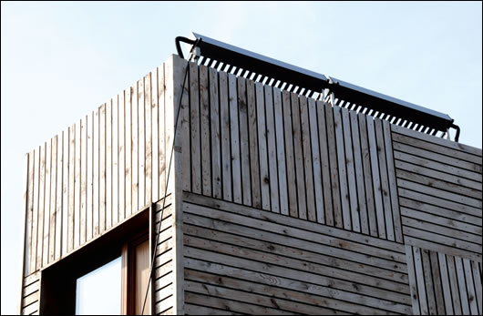 Solar vacuum tubes were installed on the cedar clad, stick-build timber frame extension to provide for hot water needs and they are orientated to maximise solar gain
