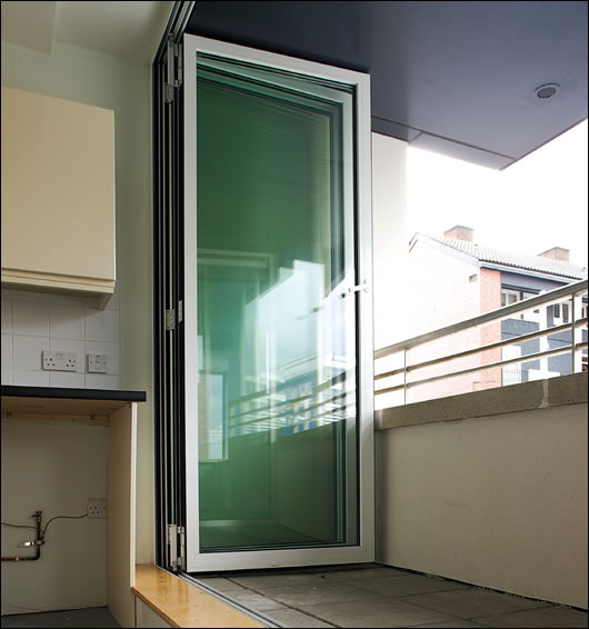 The Solarlux sliding glass system allows the balconies to remain fully exposed to the elements or, with the panels fully closed, gives the tenants use of the space during bad weather