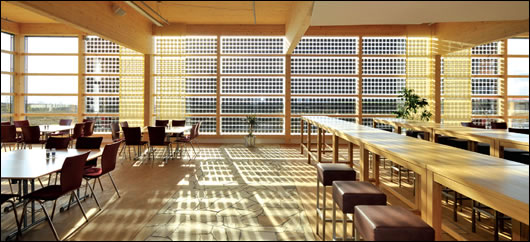 The triple-glazed canteen wall in which integrated crystalline solar cells provide the dual function of generating electricity and providing shading
