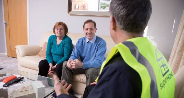 A SuperHomes engineer goes through the retrofit options with a couple in Co. Tipperary